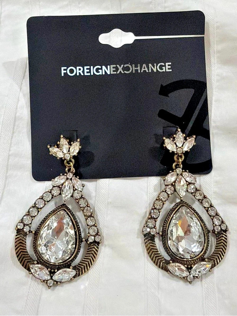 Foreign Exchange gold earrings with clear rhinestones and marquise-shaped stones